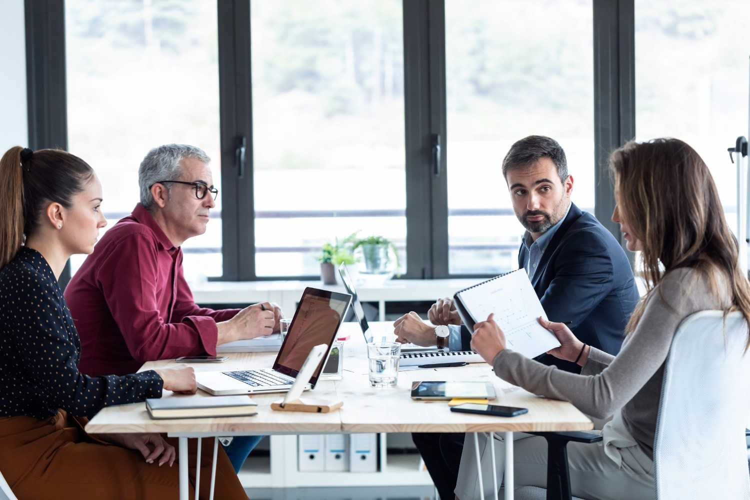 A Group Of Business Professionals Engaged In Discussion