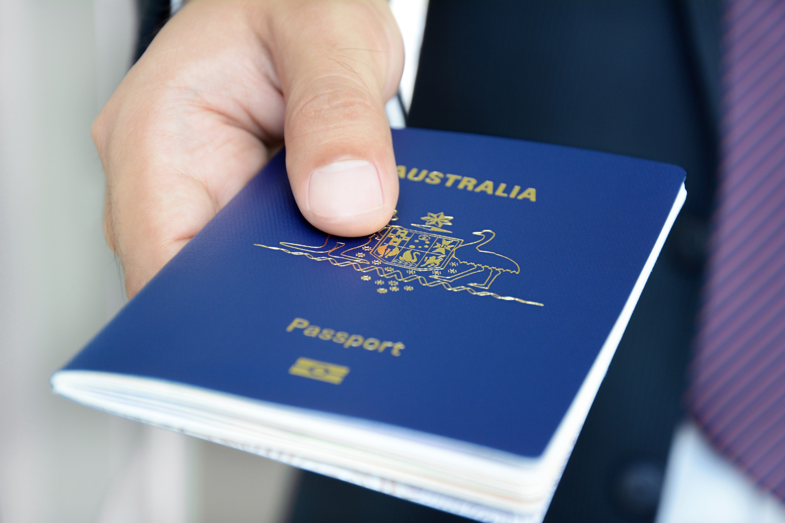 Hands Giving Passport Of Australia Hands Giving Passport Of Australia