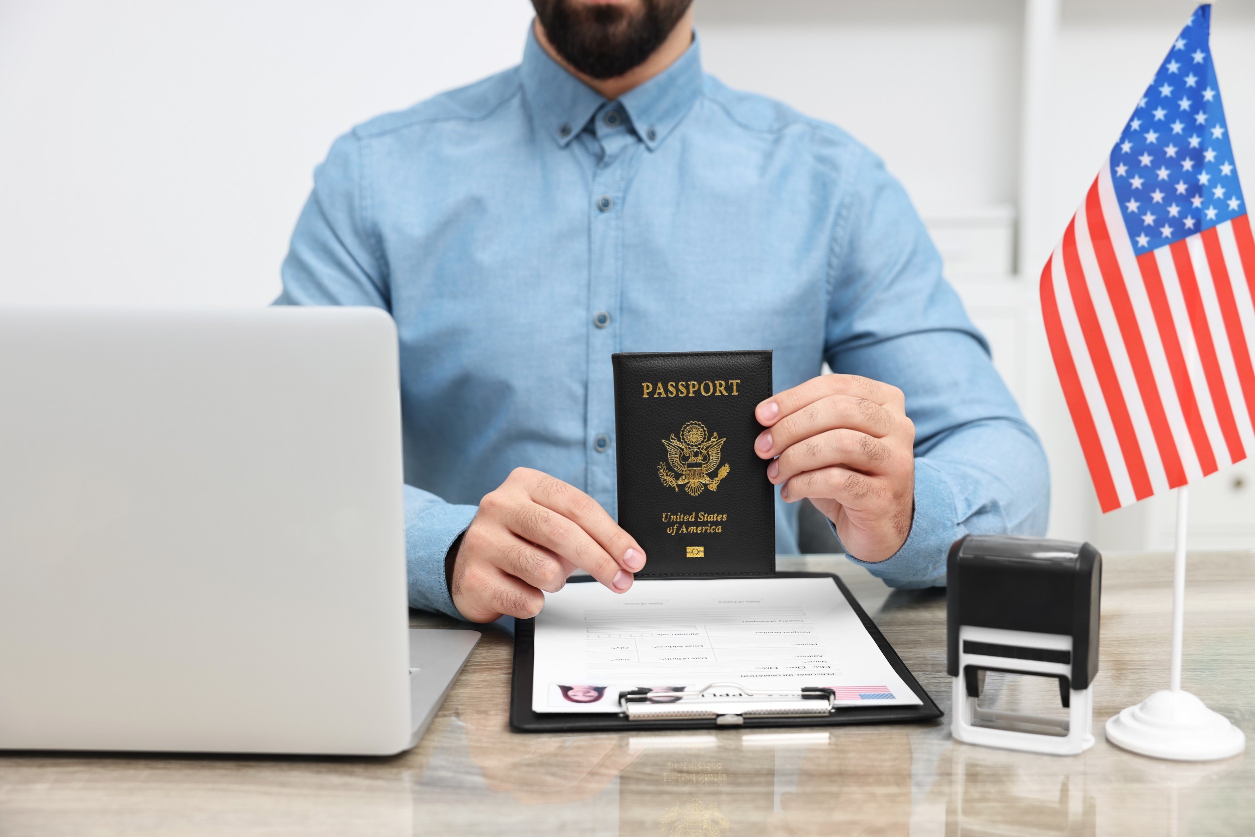 Immigration To The United States Of America Embassy Worker With Passport And Documents Immigration To The United States Of America Embassy Worker With Passport And Documents