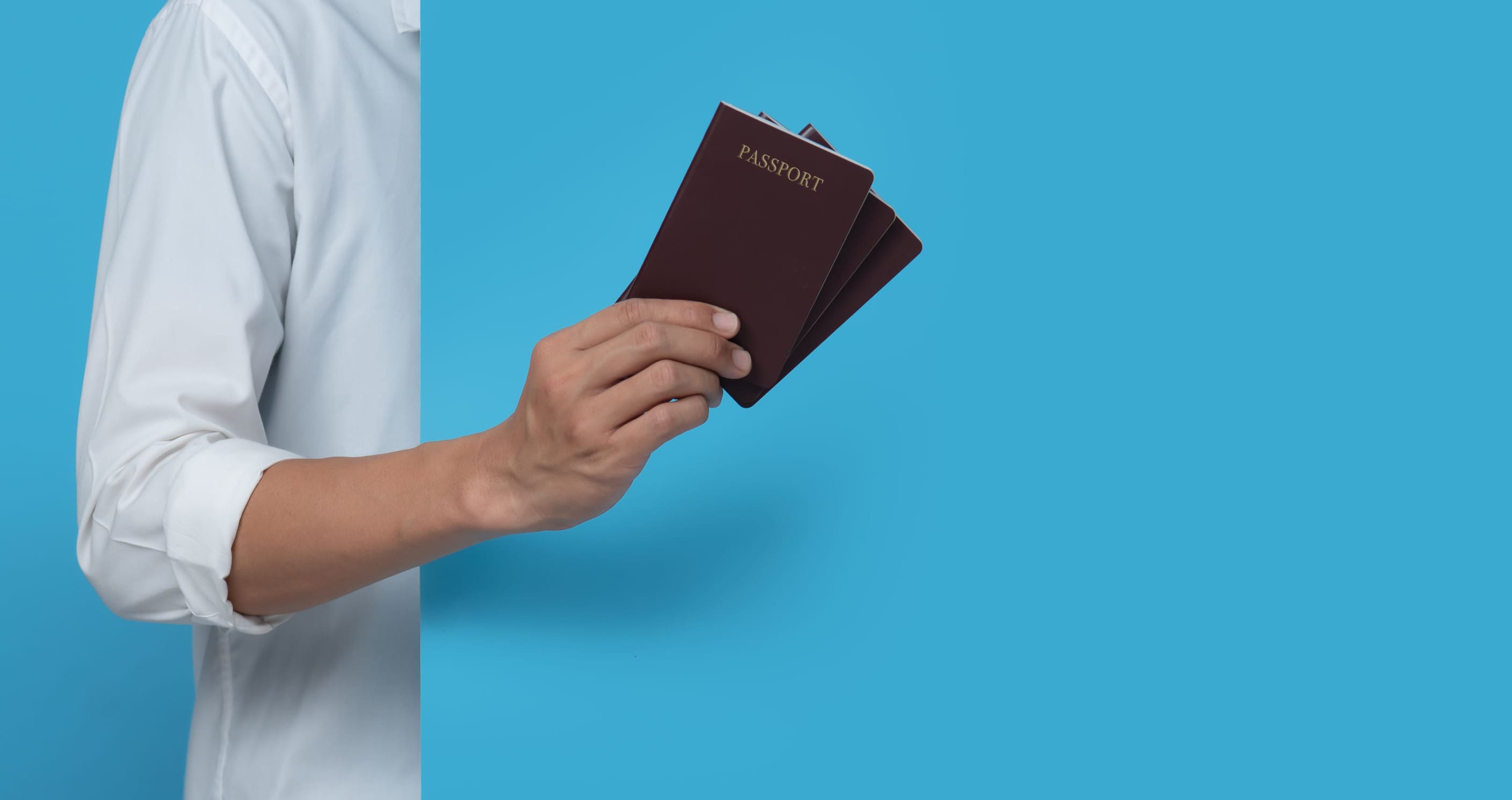 Male Hand Holding Passport
