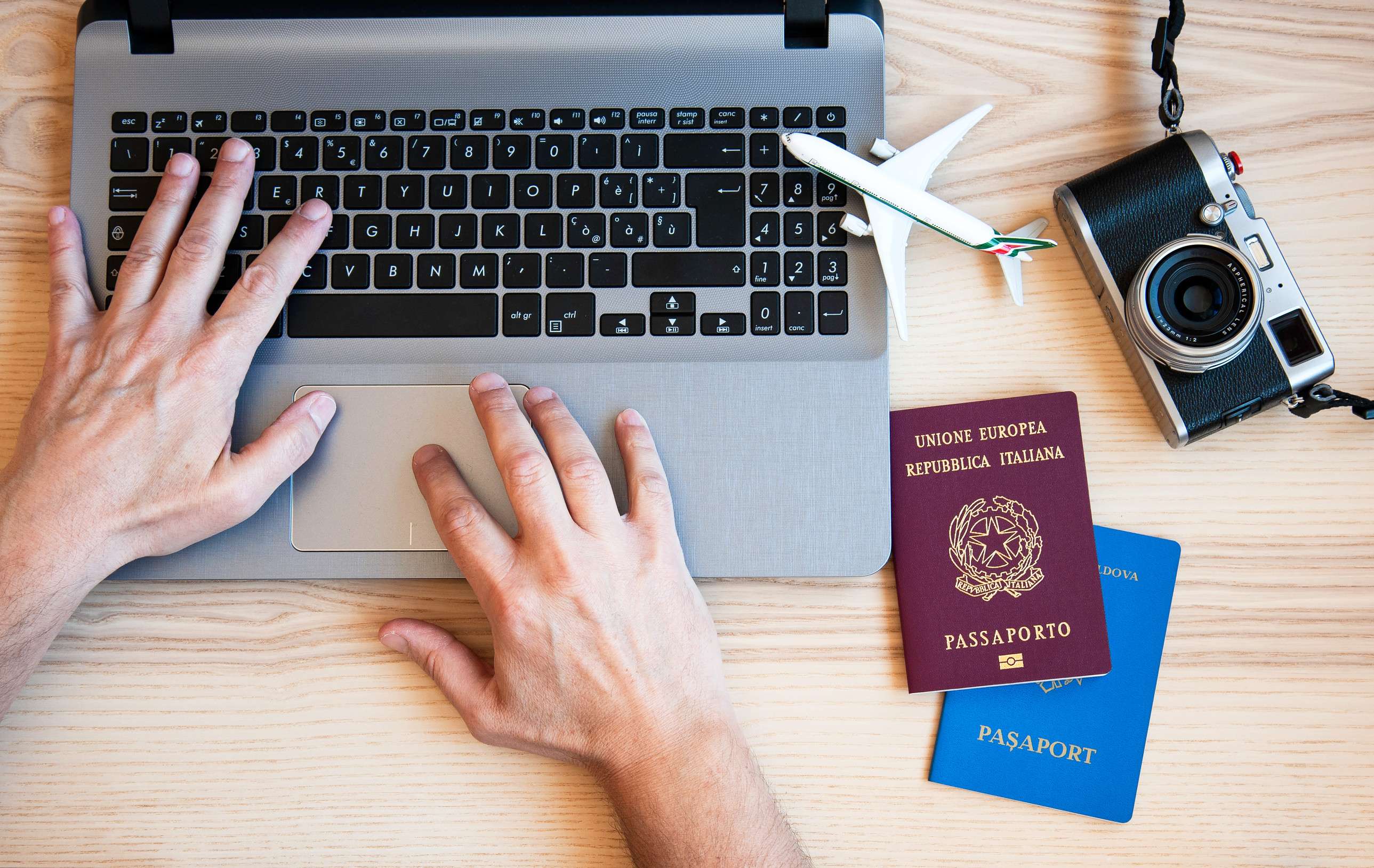 Male Hands Typing On Modern Laptop For Booking An Airplane Flight Man Plans Couple Tour Male Hands Typing On Modern Laptop For Booking An Airplane Flight Man Plans Couple Tour