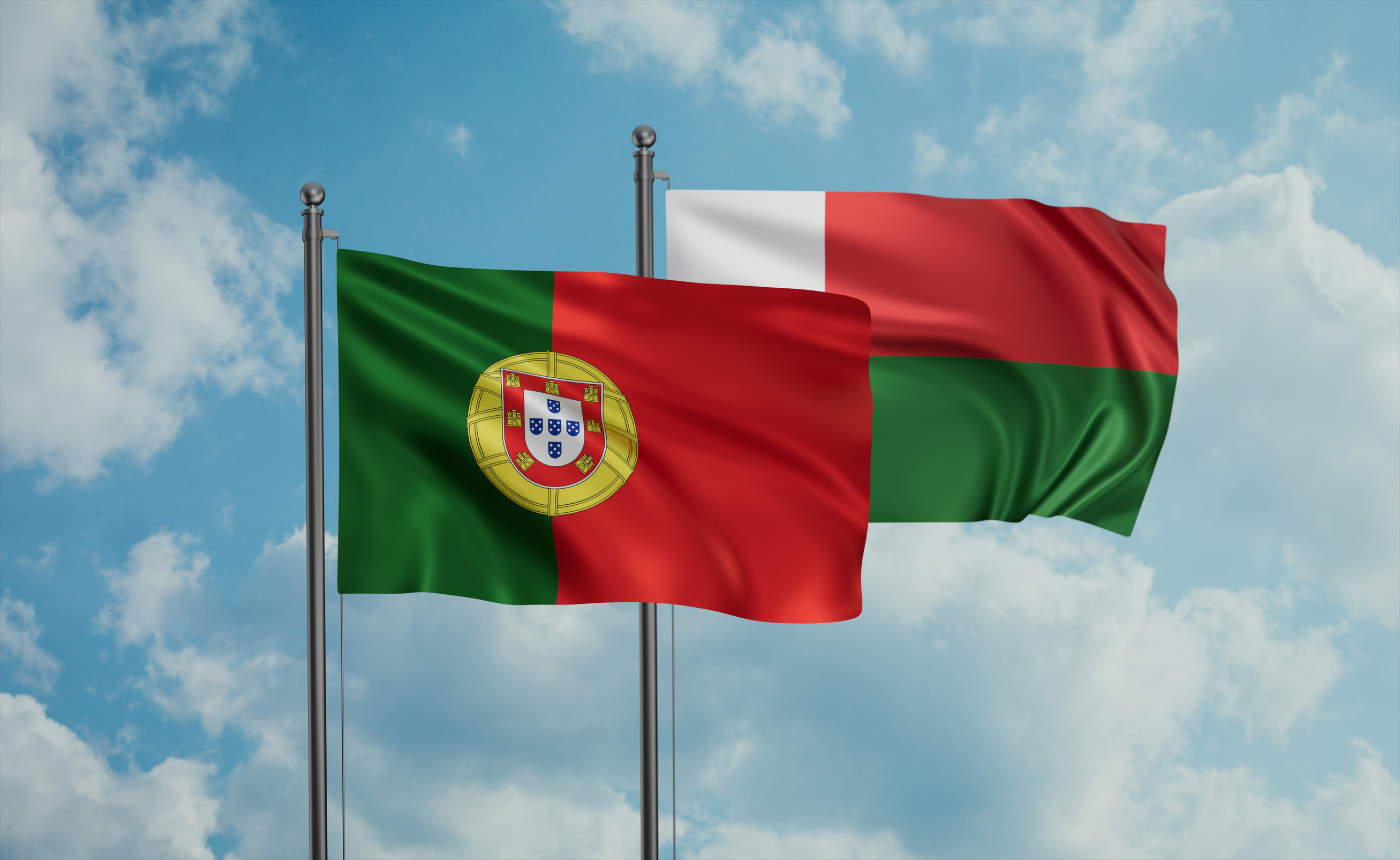 Portugal And Madagascar Flags Waving